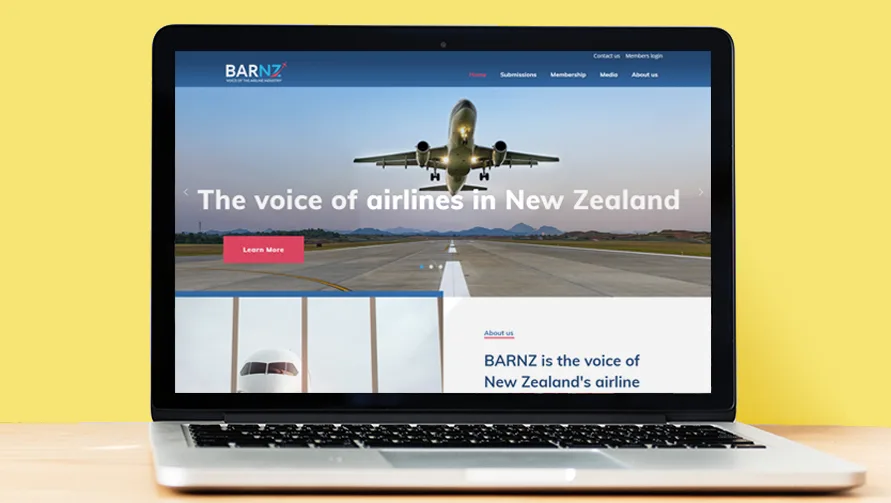The BARNZ website Applicable built with the industry body's communications agency, open on a laptop against a yellow background. BARNZ website home page with the line The voice of airlines in New Zealand, shown on a laptop